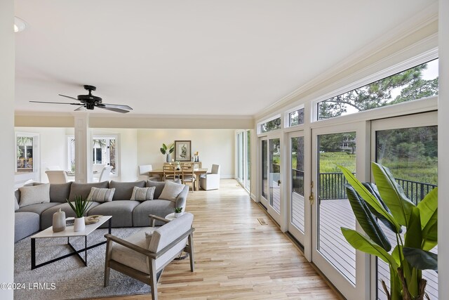 sunroom / solarium featuring ceiling fan