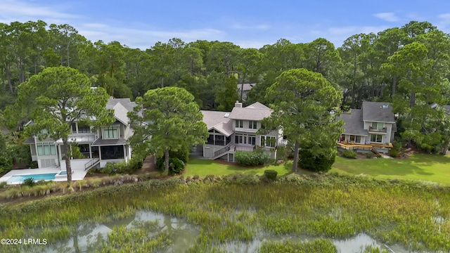 birds eye view of property with a water view