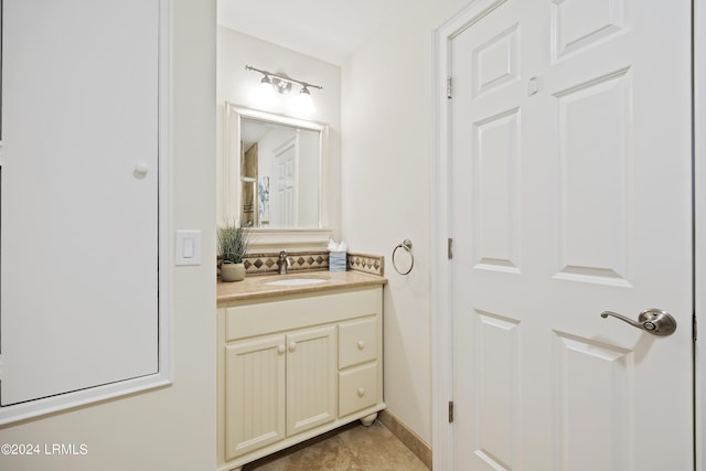 bathroom with vanity and tile patterned flooring