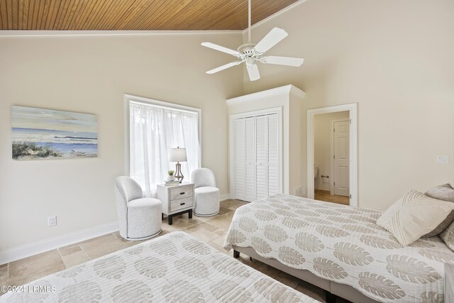 bedroom featuring high vaulted ceiling, wooden ceiling, ceiling fan, and a closet