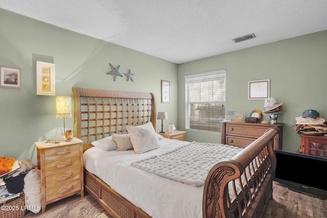 bedroom featuring a textured ceiling