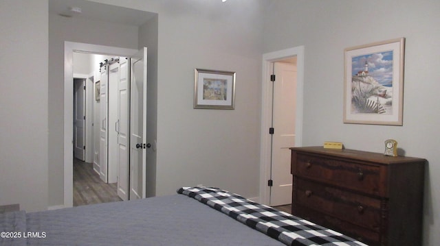 bedroom with wood finished floors