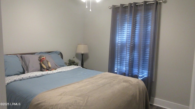 bedroom featuring baseboards