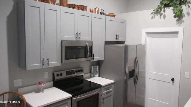 kitchen featuring appliances with stainless steel finishes and light countertops