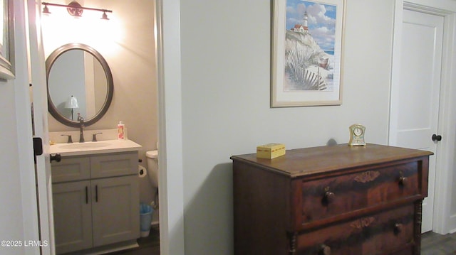 bathroom with vanity and toilet