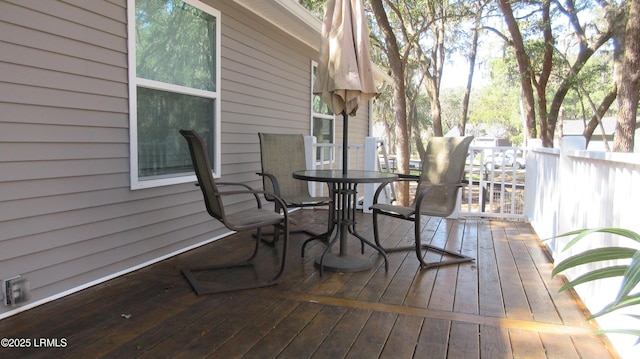 deck featuring outdoor dining area