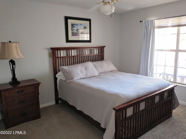 1231 Ladys Island Dr Unit 221, Port Royal, SC 29935 - bedroom featuring carpet flooring, baseboards, and multiple windows