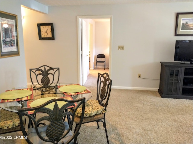 1231 Ladys Island Dr Unit 221, Port Royal, SC 29935 - dining area with baseboards and light carpet