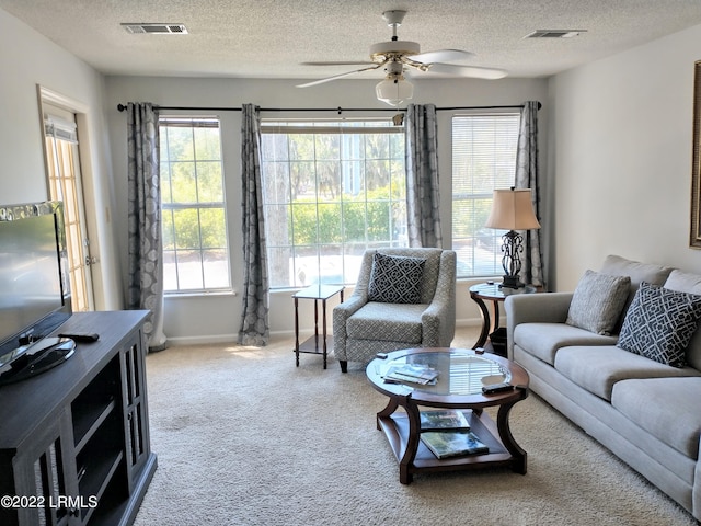 1231 Ladys Island Dr Unit 221, Port Royal, SC 29935 - living area featuring ceiling fan, a textured ceiling, and visible vents