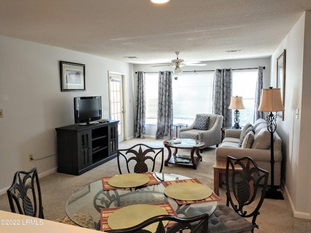 1231 Ladys Island Dr Unit 221, Port Royal, SC 29935 - living room with baseboards, ceiling fan, visible vents, and light carpet