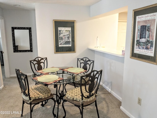 1231 Ladys Island Dr Unit 221, Port Royal, SC 29935 - dining area with carpet flooring and baseboards