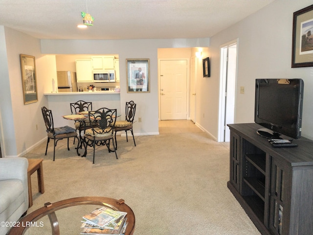1231 Ladys Island Dr Unit 221, Port Royal, SC 29935 - dining area featuring light colored carpet and baseboards
