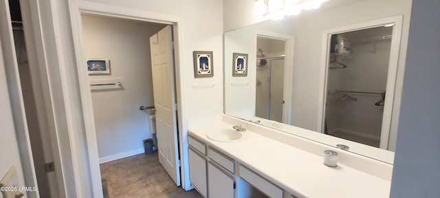 1231 Ladys Island Dr Unit 221, Port Royal, SC 29935 - full bathroom with vanity, a spacious closet, and a shower