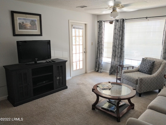 1231 Ladys Island Dr Unit 221, Port Royal, SC 29935 - living room with ceiling fan, visible vents, baseboards, and carpet