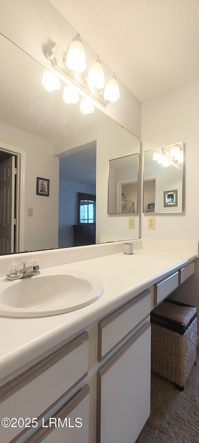 1231 Ladys Island Dr Unit 221, Port Royal, SC 29935 - bathroom with vanity and a textured ceiling