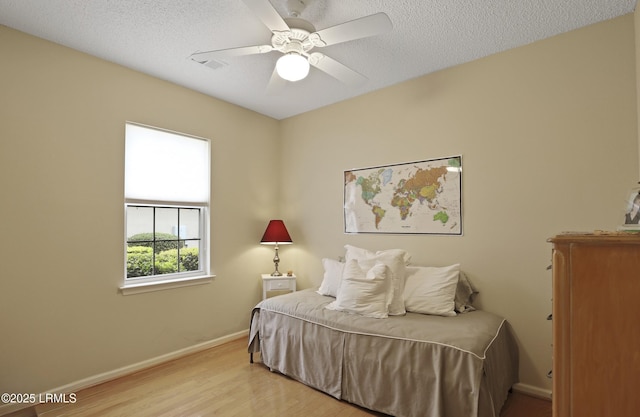 6 Callisto Rd, Okatie, SC 29909 - bedroom featuring wood finished floors, a ceiling fan, and a textured ceiling