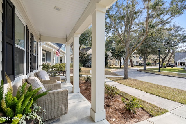 view of patio / terrace featuring covered porch and a residential view