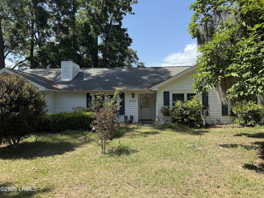 4001 Cedarbrook St, Beaufort, SC 29906 - view of front facade with a front lawn and a chimney