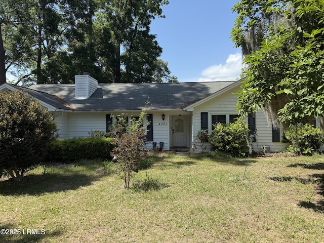 4001 Cedarbrook St, Beaufort, SC 29906 - view of front facade with a front lawn and a chimney
