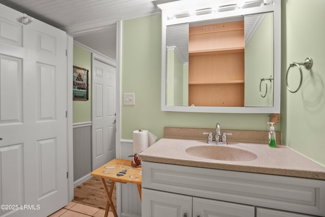373 Pike Dr, Fripp Island, SC 29920 - bathroom featuring vanity, a wainscoted wall, and tile patterned flooring