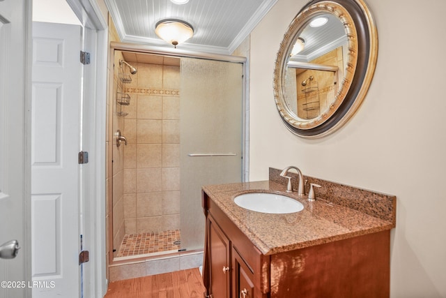 373 Pike Dr, Fripp Island, SC 29920 - full bathroom featuring a stall shower, vanity, crown molding, and wood finished floors