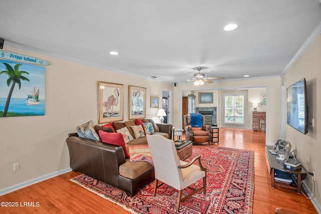 373 Pike Dr, Fripp Island, SC 29920 - living area featuring ornamental molding, wood finished floors, ceiling fan, a tile fireplace, and recessed lighting