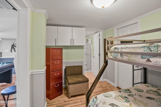 373 Pike Dr, Fripp Island, SC 29920 - bedroom with light wood-style flooring and crown molding