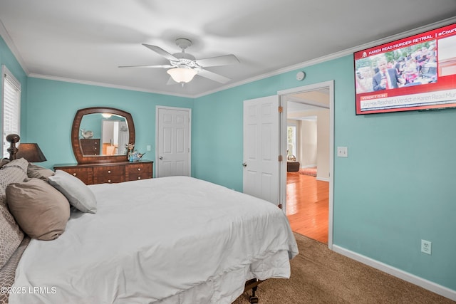 373 Pike Dr, Fripp Island, SC 29920 - bedroom with crown molding, multiple windows, a ceiling fan, and carpet floors