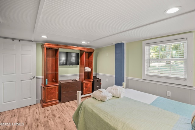 373 Pike Dr, Fripp Island, SC 29920 - bedroom with light wood finished floors, wainscoting, and recessed lighting