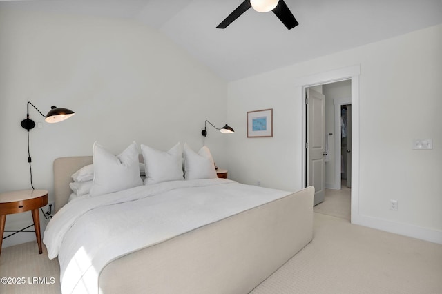bedroom featuring light carpet, baseboards, lofted ceiling, and ceiling fan