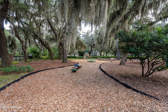 view of property's community with a playground