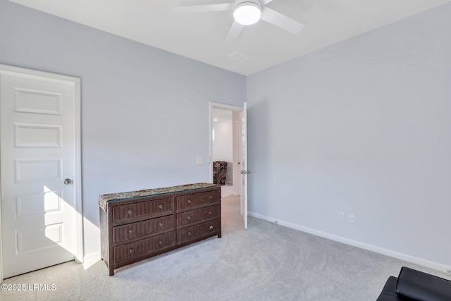 carpeted bedroom with a ceiling fan and baseboards