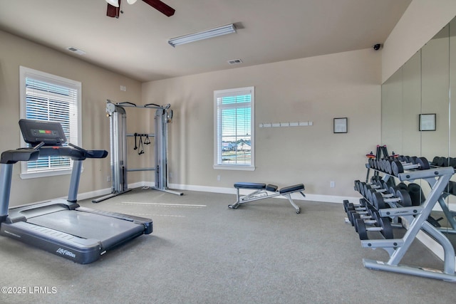 exercise room with visible vents, ceiling fan, and baseboards