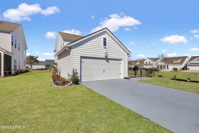 view of side of property featuring driveway, a garage, a lawn, a residential view, and fence