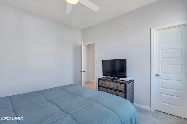 bedroom with light carpet, baseboards, visible vents, and a ceiling fan