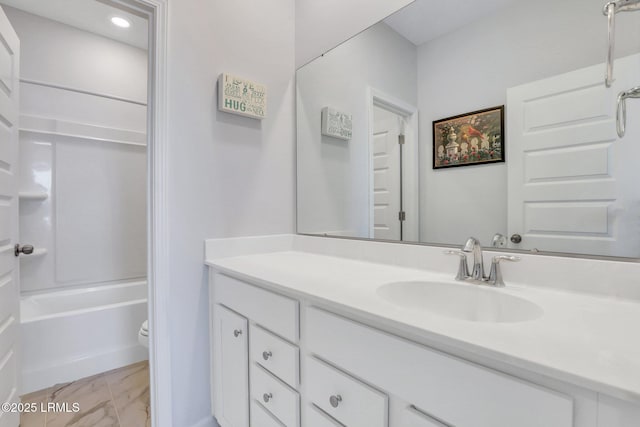 bathroom featuring marble finish floor, shower / tub combination, vanity, and toilet