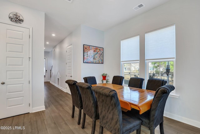 dining area with recessed lighting, wood finished floors, visible vents, and baseboards