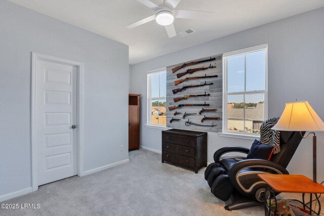 sitting room featuring a ceiling fan, carpet, visible vents, and baseboards