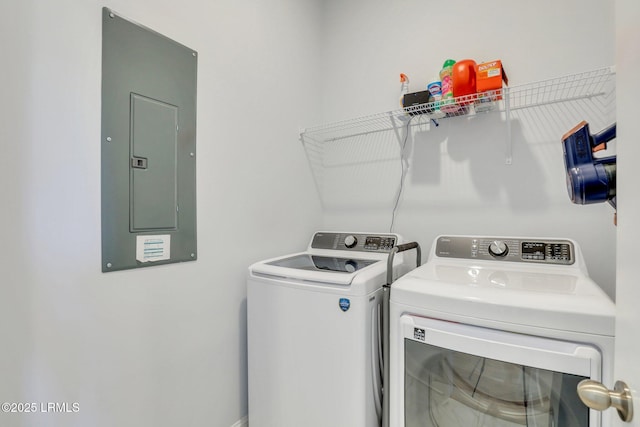 laundry area with laundry area, electric panel, and independent washer and dryer