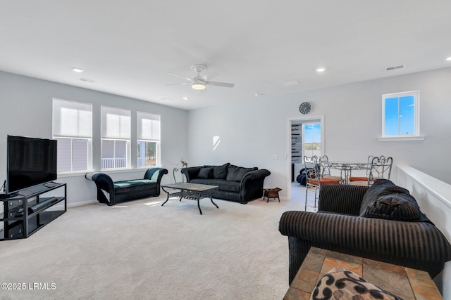 carpeted living area with a ceiling fan, recessed lighting, a healthy amount of sunlight, and visible vents