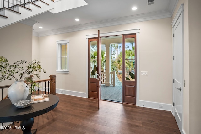 doorway featuring ornamental molding, dark hardwood / wood-style flooring, and a skylight