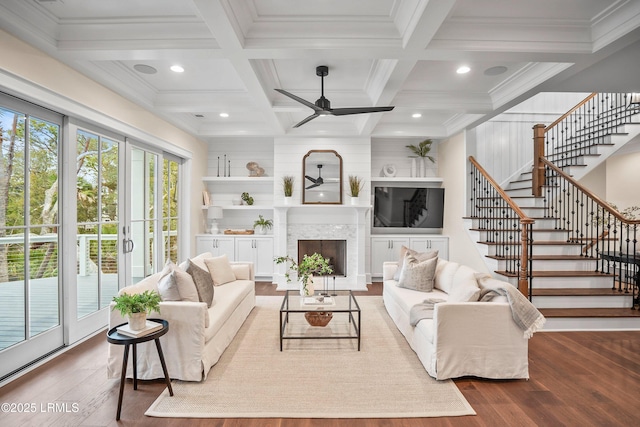 living room with coffered ceiling, hardwood / wood-style floors, beam ceiling, and ceiling fan