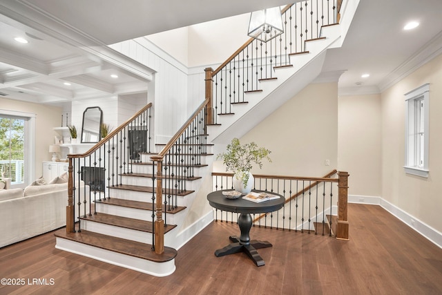 stairs with crown molding, hardwood / wood-style flooring, coffered ceiling, and beamed ceiling