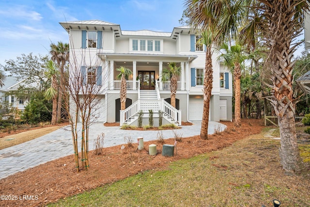 view of front facade featuring a garage and french doors