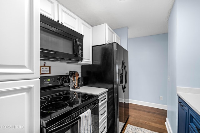 kitchen with blue cabinets, white cabinetry, and black appliances