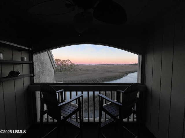 balcony at dusk with a water view