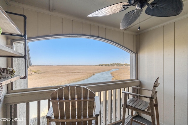 balcony with ceiling fan and a rural view