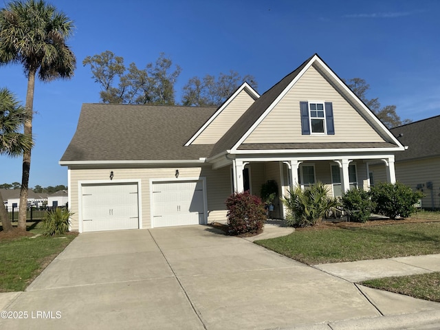 view of front of property with a porch, driveway, a garage, and roof with shingles