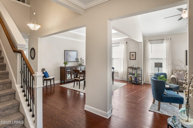 entrance foyer with baseboards, stairway, ceiling fan, and dark wood-type flooring