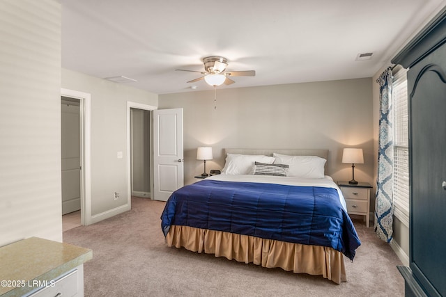 bedroom featuring light carpet, baseboards, visible vents, and ceiling fan